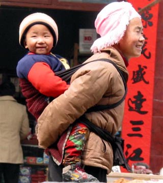 Still the traditional way to carry a baby in the minority regions of China