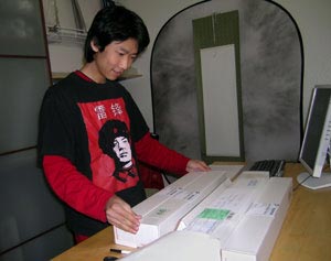 Chen Shi packing Asian artwork in San Diego