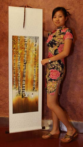 Yang Chen holds a birch forest cranes wall scroll